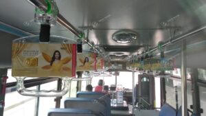 Mega We Care quảng cáo trên tay cầm xe bus